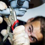 Man fixing kitchen sink