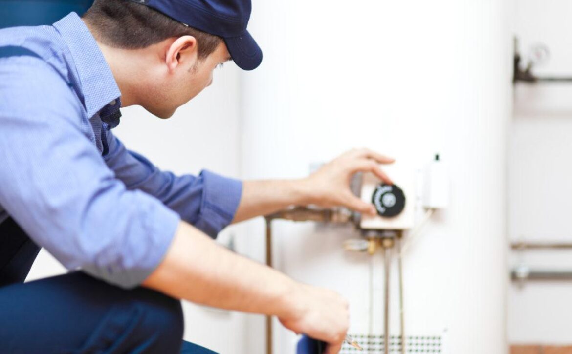 Plumber repairing an hot-water heater